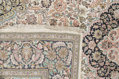 An Indian silk Kashmir rug with floral design, 20th C.