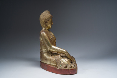 A tall Thai inlaid partly gilt lacquered wooden figure of a seated Buddha, 19th/20th C.