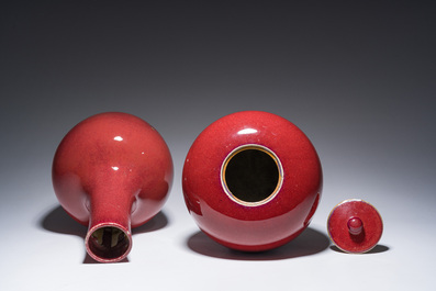 A Chinese monochrome oxblood-glazed bottle vase and a jar and cover, 19th C.