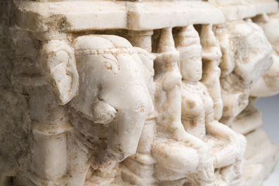 An Indian white marble Jain temple sculpture fragment with Jina flanked by elephants and a mythical lion, probably Gujarat, 15th/16th C.