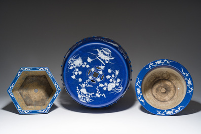 A Chinese white-slip-decorated blue-ground garden seat and two jardini&egrave;res, 19th C.