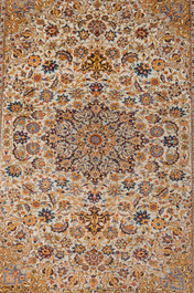 A Sino-Tabriz silk rug with floral design, 20th C.