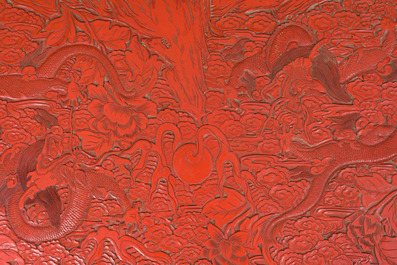 A Chinese five-piece red lacquer throne ensemble with dragons in imperial Qianlong style, 20th C.