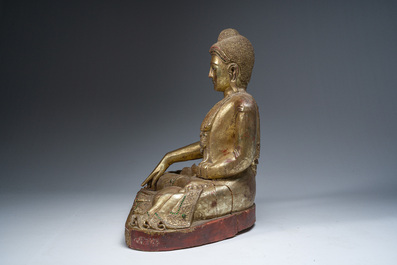 A tall Thai inlaid partly gilt lacquered wooden figure of a seated Buddha, 19th/20th C.