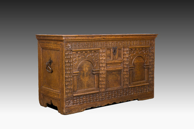 An inscribed German oak chest with two arches, 18th C.