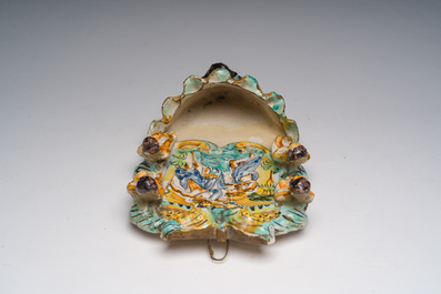 An Italian maiolica holy water font and a Spanish luster-glazed 'Madonna and Child' plaque, 17th/19th C.