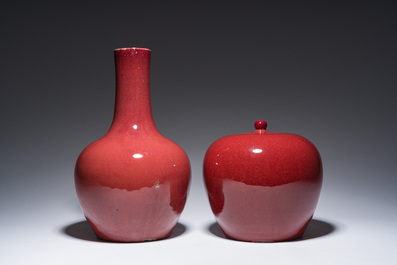 A Chinese monochrome oxblood-glazed bottle vase and a jar and cover, 19th C.