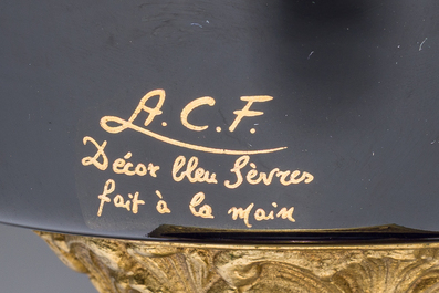 Three French gold layered blue ground gilt bronze mounted S&egrave;vres style vases and covers with gallant scenes, 20th C.