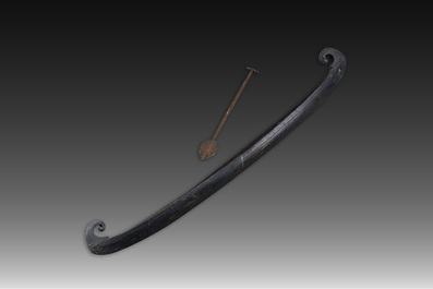 A large Indian wooden Kerala snake canoe with a curled stem and stern with accompanying paddle, 20th C.