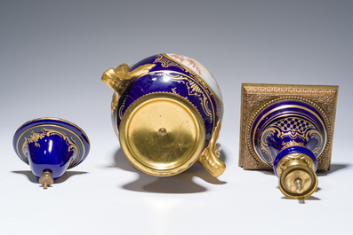 Three French gold layered blue ground gilt bronze mounted S&egrave;vres style vases and covers with gallant scenes, 20th C.
