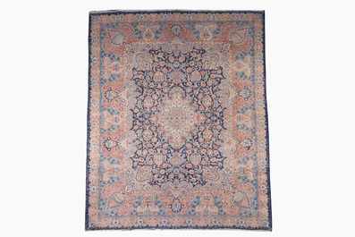 A Persian Kashmir rug with central medallion and flower vases, wool on cotton, 20th C.