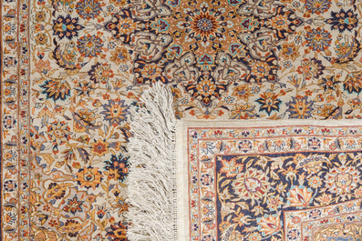 A Sino-Tabriz silk rug with floral design, 20th C.