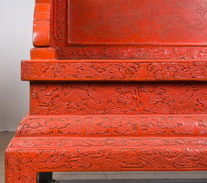A Chinese five-piece red lacquer throne ensemble with dragons in imperial Qianlong style, 20th C.