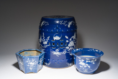 A Chinese white-slip-decorated blue-ground garden seat and two jardini&egrave;res, 19th C.