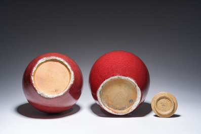 A Chinese monochrome oxblood-glazed bottle vase and a jar and cover, 19th C.