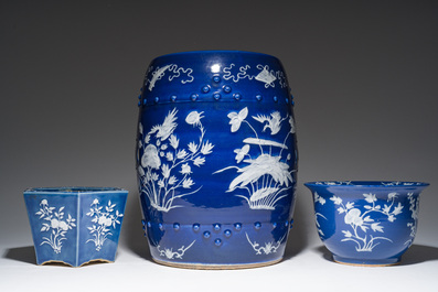 A Chinese white-slip-decorated blue-ground garden seat and two jardini&egrave;res, 19th C.