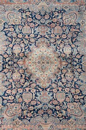 A Persian Kashmir rug with central medallion and flower vases, wool on cotton, 20th C.