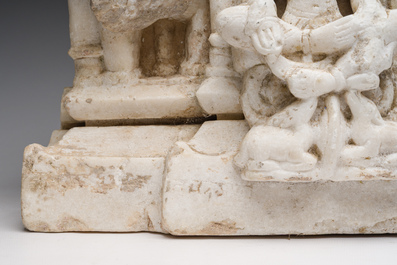 An Indian white marble Jain temple sculpture fragment with Jina flanked by elephants and a mythical lion, probably Gujarat, 15th/16th C.