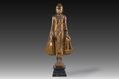 A tall Thai inlaid gilt lacquered wooden figure of a standing Buddha, 19th/20th C.