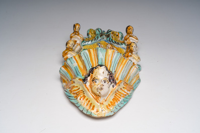An Italian maiolica holy water font and a Spanish luster-glazed 'Madonna and Child' plaque, 17th/19th C.