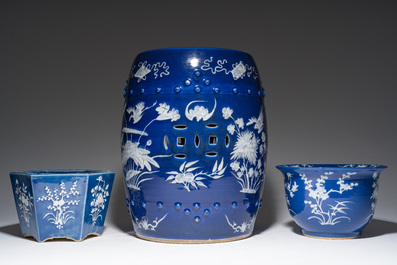 A Chinese white-slip-decorated blue-ground garden seat and two jardini&egrave;res, 19th C.