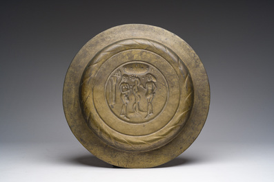 Two bells, a mortar and stamper, three candlesticks and an alms dish in bronze and brass, 17th/19th C.