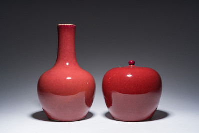 A Chinese monochrome oxblood-glazed bottle vase and a jar and cover, 19th C.