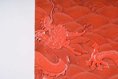 A Chinese five-piece red lacquer throne ensemble with dragons in imperial Qianlong style, 20th C.