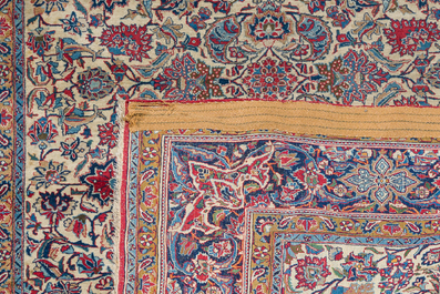 A Persian Isfahan rug with floral design, wool on silk, first half 20th C.