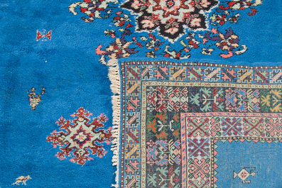 A presumably Tunisian rug with a central medallion, wool on cotton, 20th C.