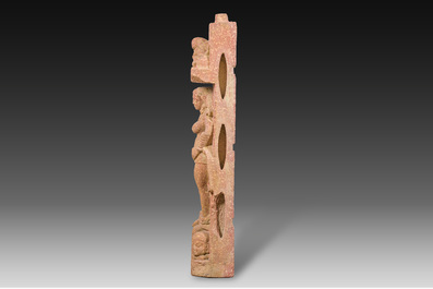A large Indian red sandstone stupa pillar with a devata shown as a woman and lotus flowers, probably Matura region, ca. 2nd C. b.C - 2nd C.