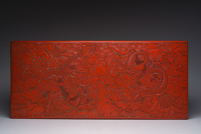A Chinese five-piece red lacquer throne ensemble with dragons in imperial Qianlong style, 20th C.