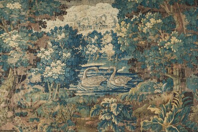A Flemish verdure wall tapestry with two swans in a lake, probably Oudenaarde, late 17th C.