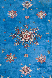 A presumably Tunisian rug with a central medallion, wool on cotton, 20th C.