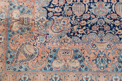 A Persian Kashmir rug with central medallion and flower vases, wool on cotton, 20th C.