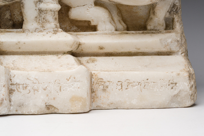 An Indian white marble Jain temple sculpture fragment with Jina flanked by elephants and a mythical lion, probably Gujarat, 15th/16th C.