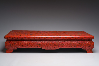 A Chinese five-piece red lacquer throne ensemble with dragons in imperial Qianlong style, 20th C.