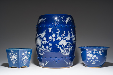 A Chinese white-slip-decorated blue-ground garden seat and two jardini&egrave;res, 19th C.