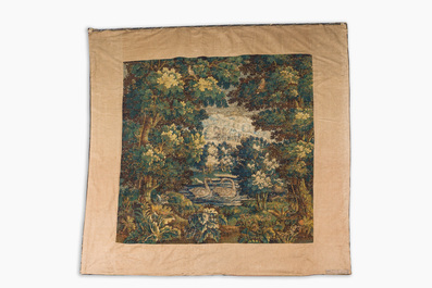 A Flemish verdure wall tapestry with two swans in a lake, probably Oudenaarde, late 17th C.