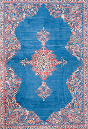 A Persian Sarouk rug with central medallion and floral design, wool on cotton, 20th C.