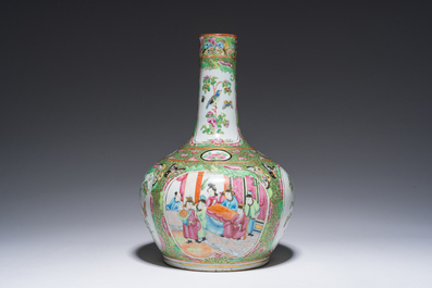 A Chinese bottle-shaped Canton famille rose vase with palace scenes and birds and butterflies among blossoming branches, 19th C.