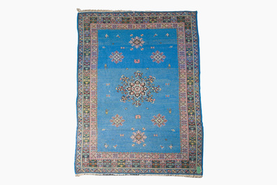 A presumably Tunisian rug with a central medallion, wool on cotton, 20th C.