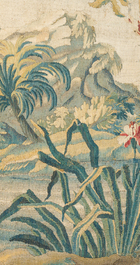 A fragment of a Flemish wall tapestry with a landscape, 17th C.