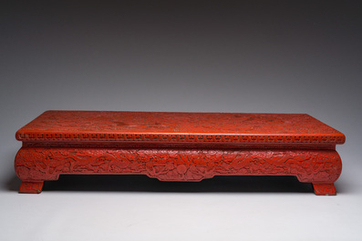 A Chinese five-piece red lacquer throne ensemble with dragons in imperial Qianlong style, 20th C.