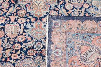 A Persian Kashmir rug with central medallion and flower vases, wool on cotton, 20th C.