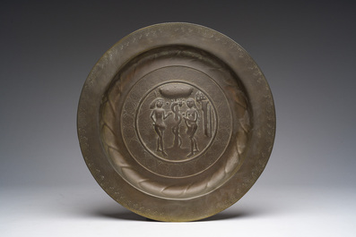 Two bells, a mortar and stamper, three candlesticks and an alms dish in bronze and brass, 17th/19th C.