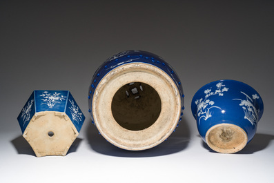 A Chinese white-slip-decorated blue-ground garden seat and two jardini&egrave;res, 19th C.