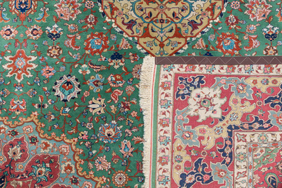 A Persian Tabriz rug with floral design, wool on cotton, first half 20th C.