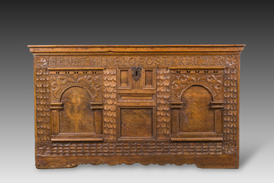 An inscribed German oak chest with two arches, 18th C.