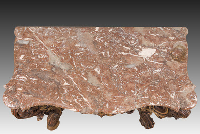 An impressive parcel-gilt and patinated wooden console in Rococo style, probably Italy, 19th C.
